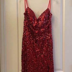 Spaghetti strap dark red formal dress with front slit.